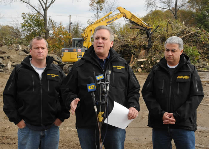 Mangano overlooks storm debris