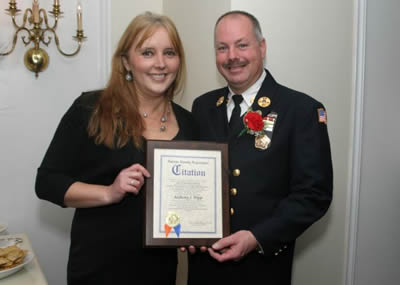 Nassau County Legislator Delia DeRiggi-Whitton presenting a citation to Chief Anthony Tripp. 