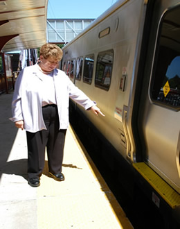 Presiding Officer Jacobs points out the large gap at the Syosset train station