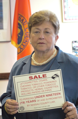 Presiding Officer Jacobs with Tobacco 19 sign. 