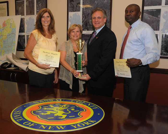 Mangano accepts trophy for largest donation to make a splash food drive