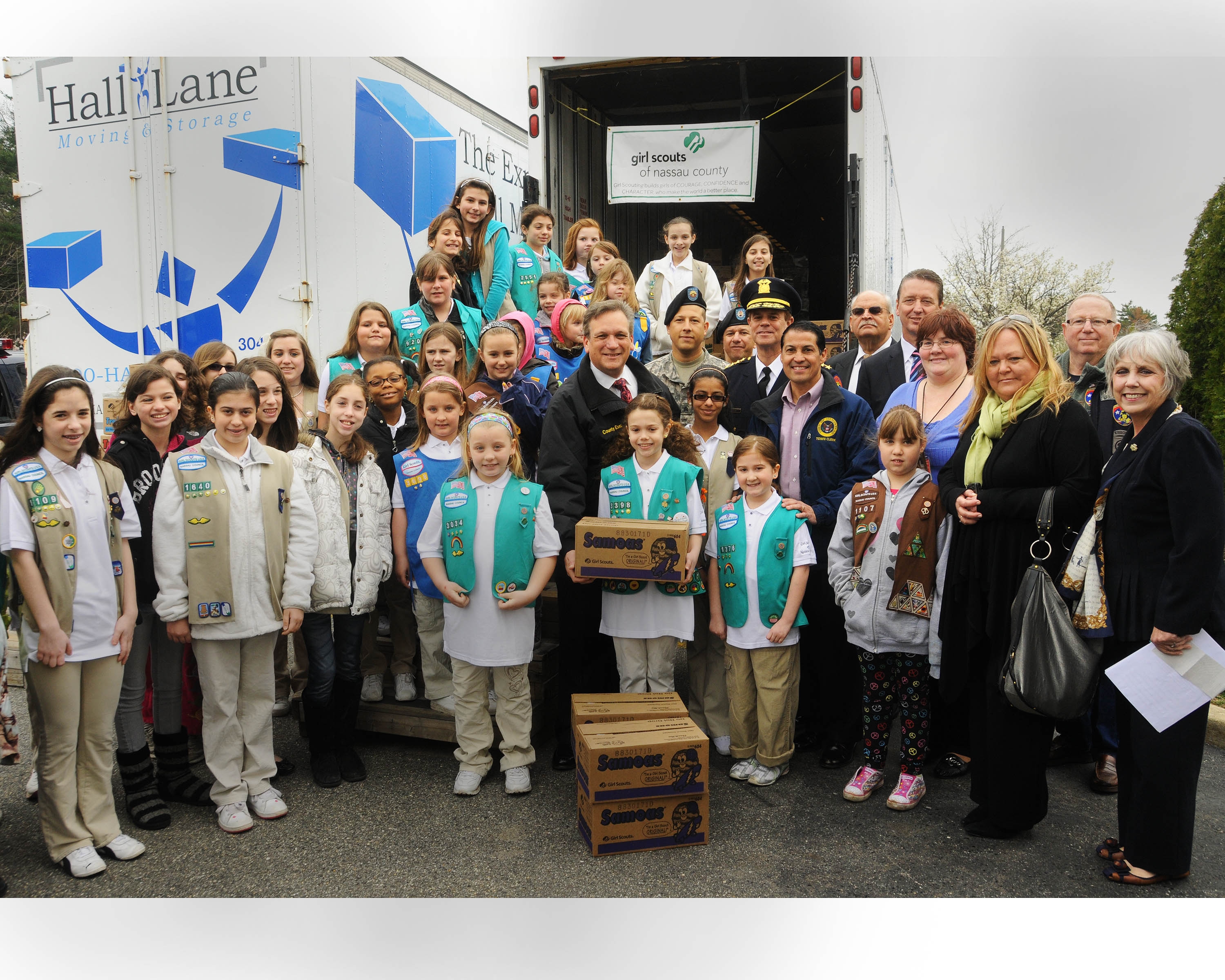 Mangano and girl scouts ship cookies to military