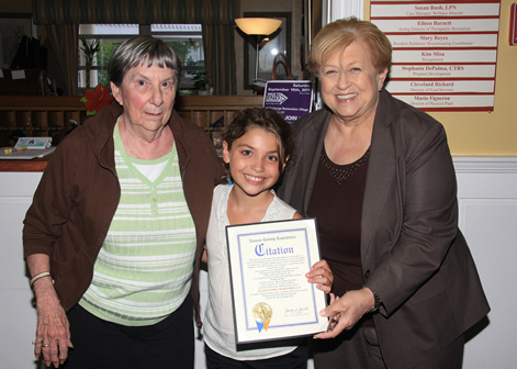 Pictured with Legislator Jacobs is Alessandra Martorella, creator of the “Building Bridges” charitable endeavor and a resident of Oyster Bay Manor.