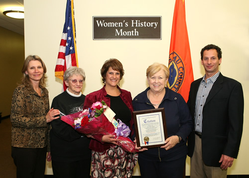 Michele is pictured with her family during the March 21st presentation ceremony.