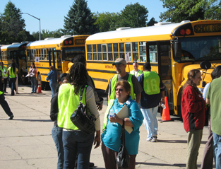Residents boarding buses